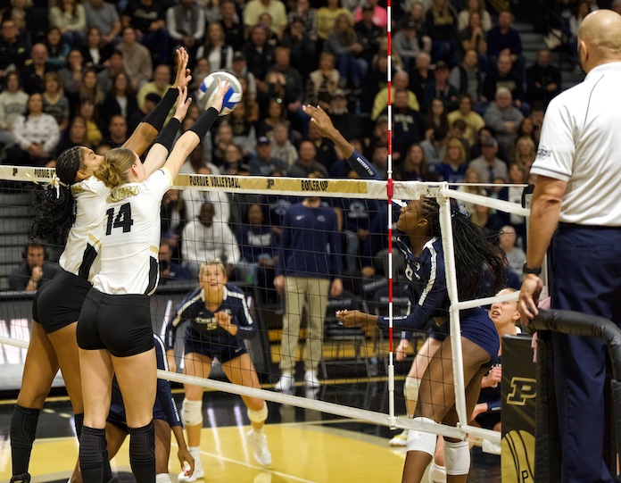 Purdue's Lourdes Meyers and Grace Heaney block during a Big 10 conference win