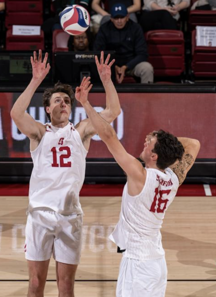 Nathan Lietzke sets Stanford teammate Nathaniel Gates in an NCAA men's volleyball match in Palo Alto, California, January 10 2024